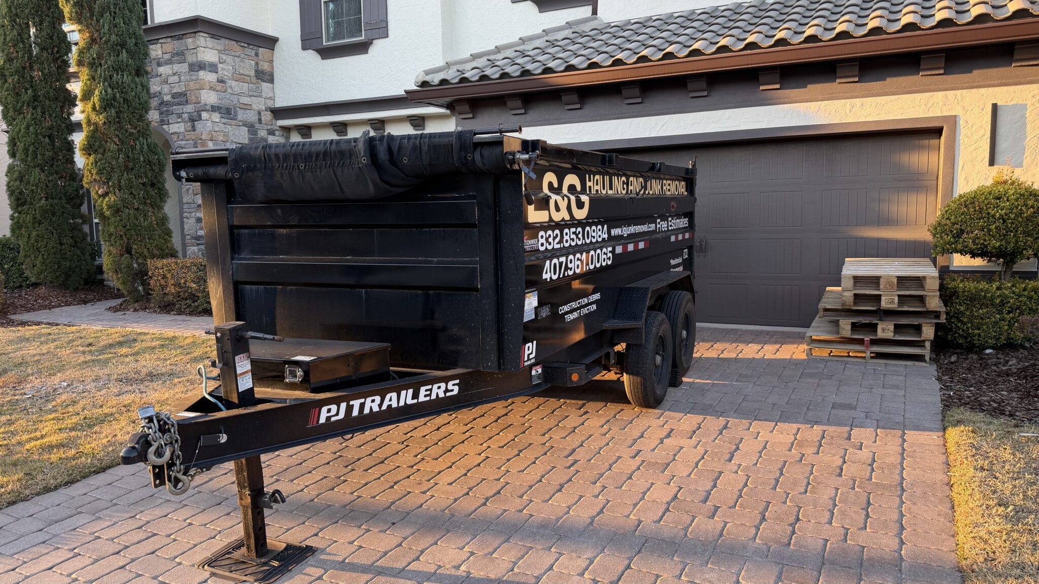 Black dumpster rental delivered by L&G Junk Removal in Orlando, Florida.