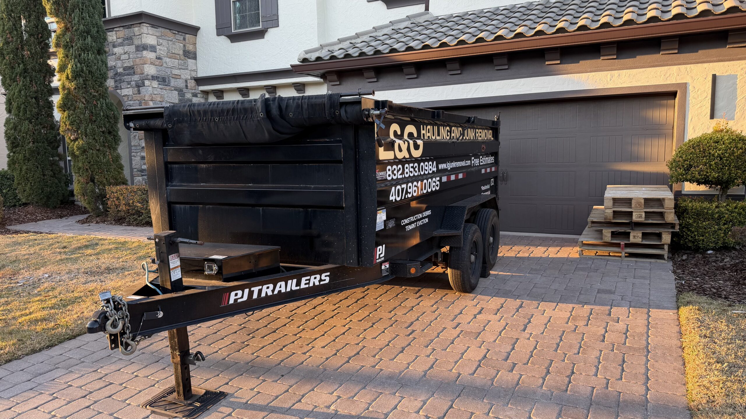 Black dumpster rental delivered by L&G Junk Removal in Orlando, Florida.