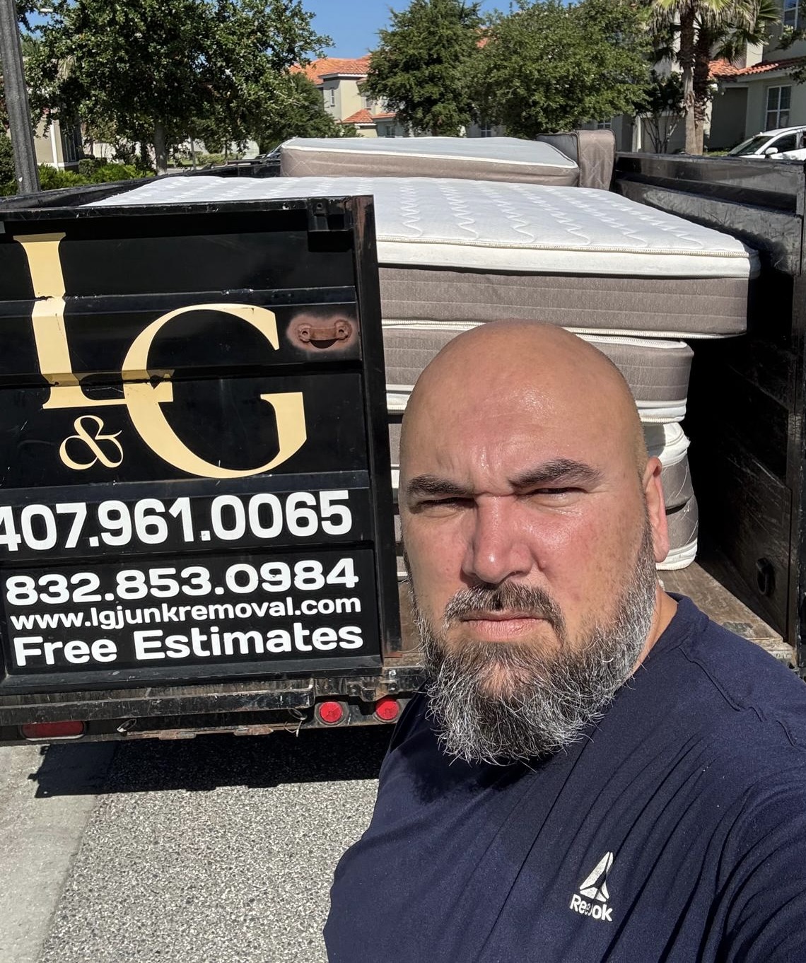 L&G Junk Removal trailer loaded with old mattresses during a mattress removal service in Orlando, FL.