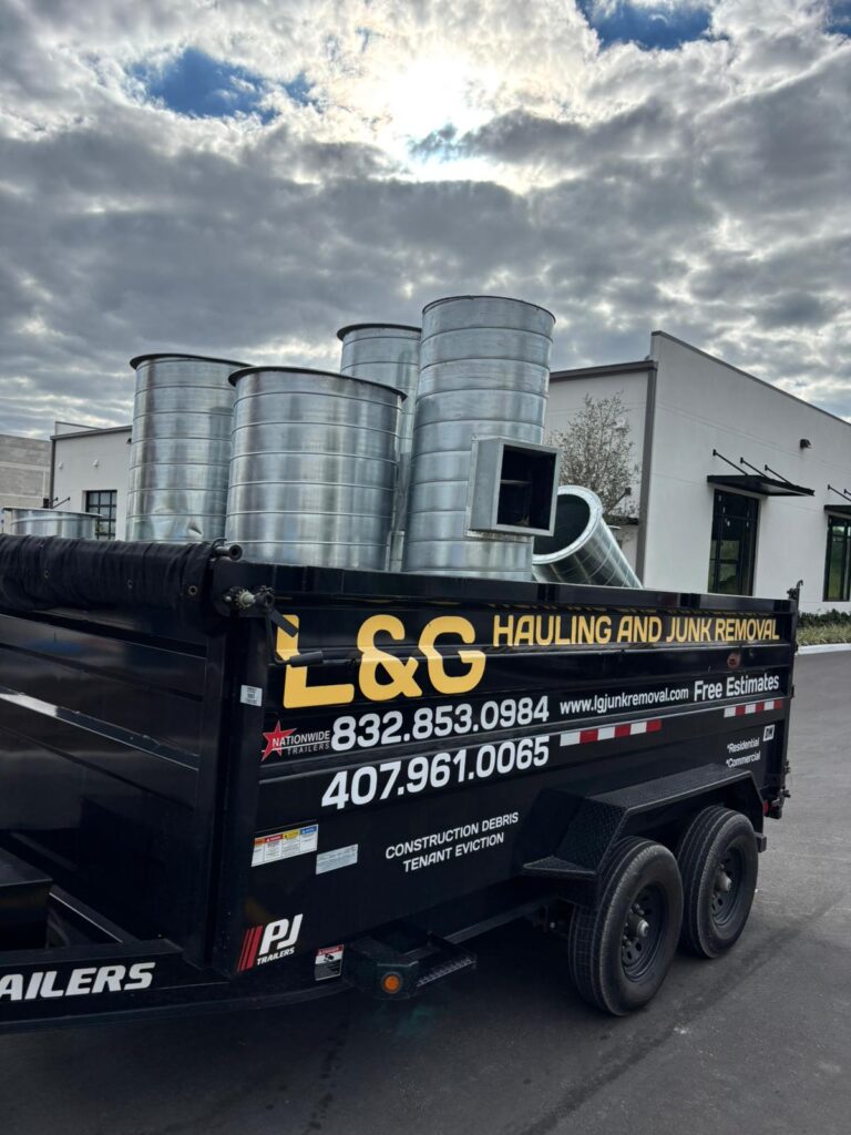 Construction debris being removed by L&G Junk Removal during a cleanup project in Orlando, FL.