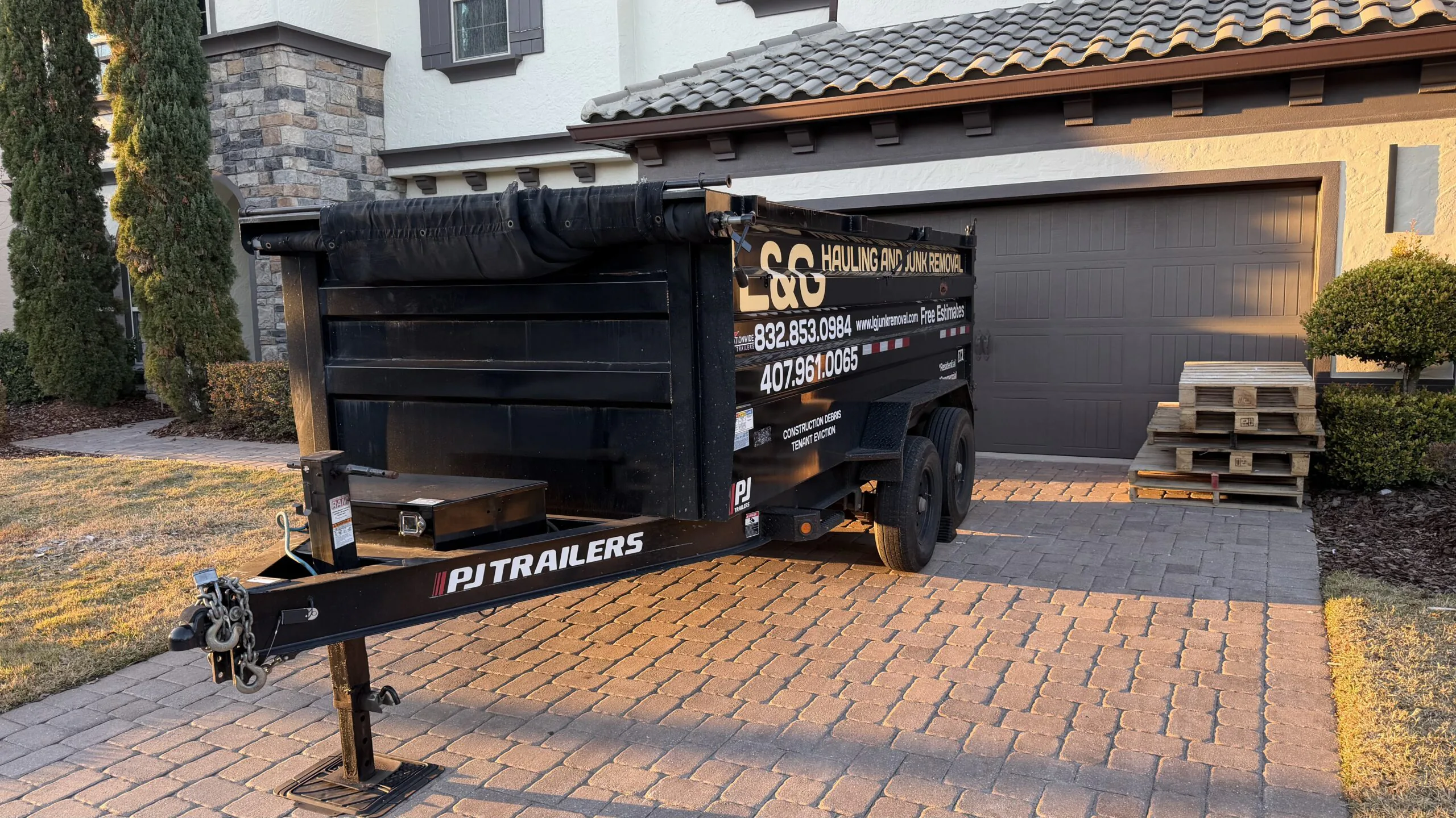 Black dumpster rental delivered by L&G Junk Removal in Orlando, Florida.